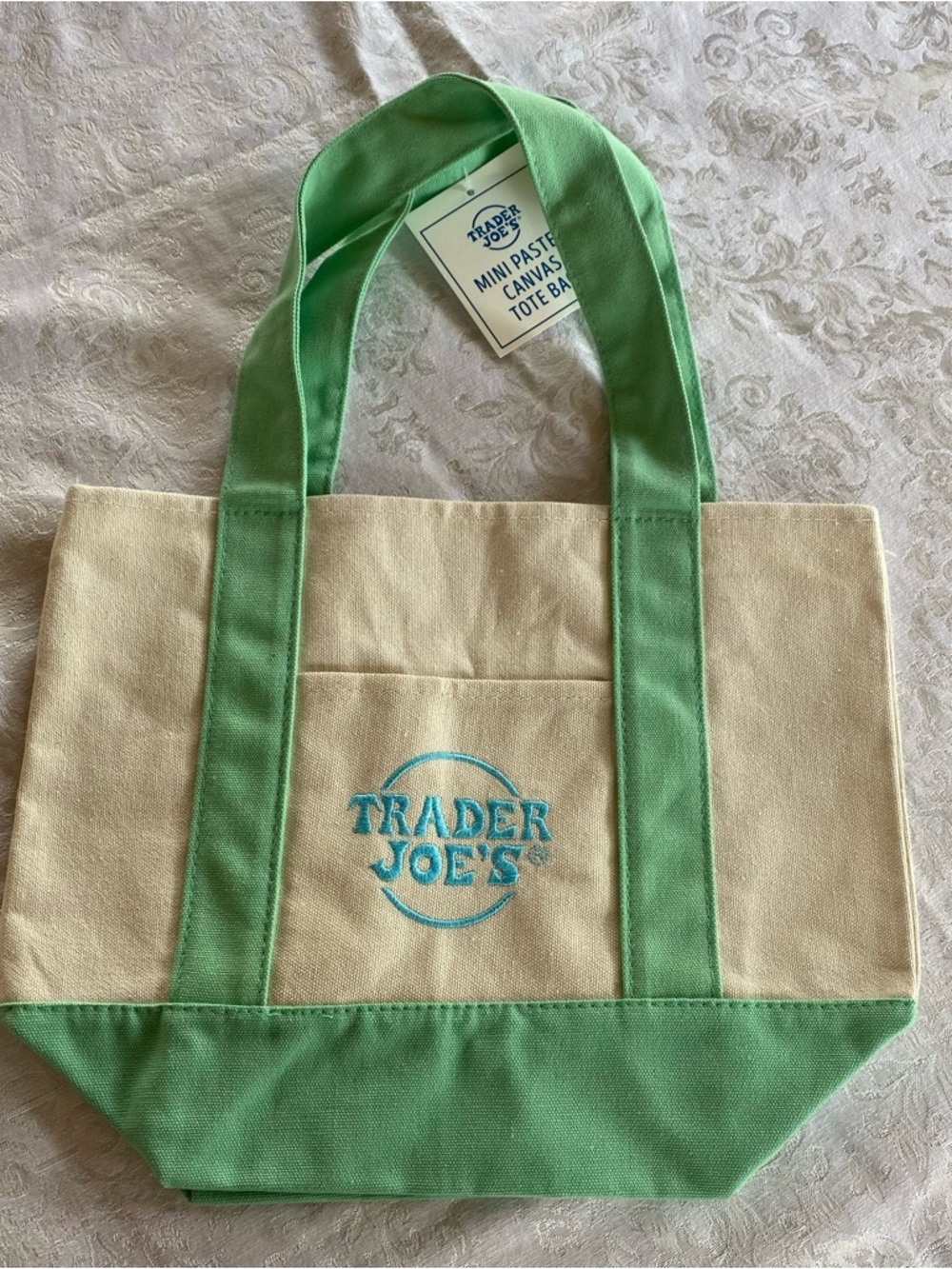 1 Trader Joe's Mini Foldable Canvas Tote Bag in pastel green.